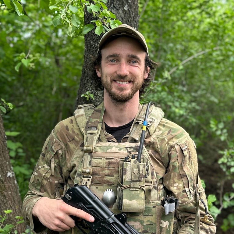 Dimko Zhluktenko in uniform in the forest